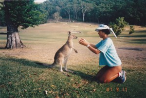 At South Molle, playing with a wallaby...